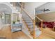 Inviting foyer showcasing hardwood floors, staircase, and a glimpse into the cozy living area with natural light at 495 Stonehaven Dr, Fayetteville, GA 30215