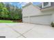 Spacious three-car garage with a wide driveway, offering ample parking and convenience at 495 Stonehaven Dr, Fayetteville, GA 30215