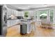 Bright kitchen with stainless appliances, island seating, and eat in breakfast nook with lots of light at 495 Stonehaven Dr, Fayetteville, GA 30215