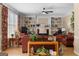 Bright living room with hardwood floors, fireplace, and built-in shelving offers a welcoming space at 495 Stonehaven Dr, Fayetteville, GA 30215