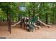 Community playground with slides, climbing structures, and a wood chip ground cover at 495 Stonehaven Dr, Fayetteville, GA 30215