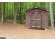 Backyard storage shed in a wooded area, perfect for tools and equipment at 495 Stonehaven Dr, Fayetteville, GA 30215