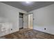 Neutral bedroom with carpet, white walls, closet, and doors in the room, providing a blank canvas for personalization at 1147 Tanglewood Rd, Jonesboro, GA 30236