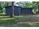 Charming one story home with dark painted brick exterior and lush front yard at 1147 Tanglewood Rd, Jonesboro, GA 30236