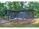 Charming home with a brick exterior, well-kept lawn, and inviting entrance, nestled among lush trees at 1147 Tanglewood Rd, Jonesboro, GA 30236