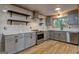 Modern kitchen featuring stainless steel appliances, bright countertops and hardwood floors at 1147 Tanglewood Rd, Jonesboro, GA 30236