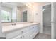 Bathroom with a double sink vanity, large mirror and view to bedroom at 1716 Anniston Dr, Mcdonough, GA 30253