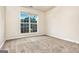 Sunlit bedroom with a large window providing a view of lush greenery at 1716 Anniston Dr, Mcdonough, GA 30253