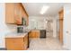 Open-concept kitchen showcasing granite counters, black appliances, and tile flooring at 1716 Anniston Dr, Mcdonough, GA 30253