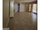 Bedroom featuring tile flooring, closet, chandelier, and door to backyard at 9163 Fair Sw St, Covington, GA 30014