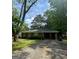 Charming brick ranch home with a well-maintained lawn and covered parking area at 9163 Fair Sw St, Covington, GA 30014