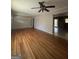 Living room showcasing hardwood floors, open layout, and natural light at 9163 Fair Sw St, Covington, GA 30014