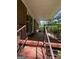 Covered patio with metal railings, offering a perfect spot for outdoor relaxation and enjoying the view at 9163 Fair Sw St, Covington, GA 30014