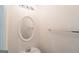 Small powder room with round mirror, bright white walls, and white sink at 1281 Heartwood Ave, Mcdonough, GA 30253