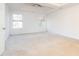 Bedroom with carpet flooring and two windows offering natural light at 1281 Heartwood Ave, Mcdonough, GA 30253