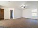 Spacious bedroom with carpet, a ceiling fan, and an ensuite bathroom at 1281 Heartwood Ave, Mcdonough, GA 30253