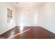 Bright dining room with hardwood floors, and white wainscoting at 1281 Heartwood Ave, Mcdonough, GA 30253