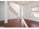 Spacious living room with hardwood floors, white wainscoting, and a staircase leading to the second floor at 1281 Heartwood Ave, Mcdonough, GA 30253