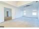 Bright main bedroom with carpet, recessed ceiling, ceiling fan, and two windows for lots of natural light at 1281 Heartwood Ave, Mcdonough, GA 30253