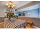 Dining room featuring a chandelier and view of the living room at 75 Puppy Chase, Social Circle, GA 30025