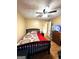 Cozy bedroom with hardwood floors, ceiling fan and a comfortable bed at 104 Hillmont Dr, Woodstock, GA 30188
