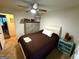 Comfortable bedroom with neutral tones, a ceiling fan and ample storage at 104 Hillmont Dr, Woodstock, GA 30188