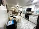 Bright, modern kitchen with stainless steel appliances and an adjacent dining area at 104 Hillmont Dr, Woodstock, GA 30188