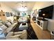 Spacious living room with hardwood floors, ceiling fan, and comfortable seating arrangements at 104 Hillmont Dr, Woodstock, GA 30188