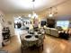 Open living space featuring a dining area, living room, and a fireplace at 104 Hillmont Dr, Woodstock, GA 30188