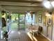 Relaxing screened porch featuring outdoor dining set and garden view at 104 Hillmont Dr, Woodstock, GA 30188