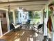 Inviting screened porch with comfortable seating and ceiling fan at 104 Hillmont Dr, Woodstock, GA 30188