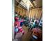 Well-organized shed interior with storage containers and various tools at 104 Hillmont Dr, Woodstock, GA 30188