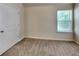 This bedroom offers a window for natural light and a closet for storage at 749 Rolling Downs Dr, Loganville, GA 30052