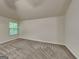 Bedroom with plush carpet and a window at 749 Rolling Downs Dr, Loganville, GA 30052