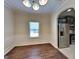 Dining room featuring modern lighting, wood floors, and stainless steel appliances in view at 749 Rolling Downs Dr, Loganville, GA 30052