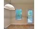 The dining area has tile floors, a window, and a door to the outside at 749 Rolling Downs Dr, Loganville, GA 30052