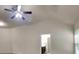 Bright living room space with vaulted ceilings and a ceiling fan at 749 Rolling Downs Dr, Loganville, GA 30052