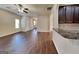 Open-concept living space features hardwood floors, neutral paint, and lots of natural light at 749 Rolling Downs Dr, Loganville, GA 30052
