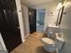 Bathroom featuring a toilet, vanity and shower with dark colored features at 800 Attaway Rd, Bowdon, GA 30108