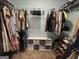Walk-in closet featuring clothing racks, shelving, shoe storage, and multiple organizational features at 800 Attaway Rd, Bowdon, GA 30108