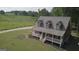 An exterior view of the home with a well-manicured lawn and charming front porch at 800 Attaway Rd, Bowdon, GA 30108