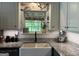 Close-up of kitchen sink featuring new faucet, stainless steel appliances at 800 Attaway Rd, Bowdon, GA 30108