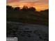 A gorgeous sunset illuminates the landscape at 800 Attaway Rd, Bowdon, GA 30108