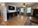 Bright living room boasts hardwood floors, fireplace, and modern entertainment center at 800 Attaway Rd, Bowdon, GA 30108