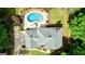 Overhead view of brick home, in-ground pool, gorgeous backyard, mature trees and landscaped grounds at 255 Emerald Lake Dr, Fayetteville, GA 30215