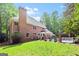 Brick home featuring large backyard, mature trees and an in-ground pool at 255 Emerald Lake Dr, Fayetteville, GA 30215