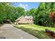 Spacious home with well-manicured lawn and a long driveway at 255 Emerald Lake Dr, Fayetteville, GA 30215