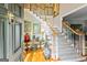 Gracious foyer with hardwood floors, staircase, and decorative accents at 255 Emerald Lake Dr, Fayetteville, GA 30215