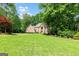 Charming two-story brick house with a well-manicured green lawn at 255 Emerald Lake Dr, Fayetteville, GA 30215