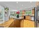 Open kitchen design featuring an island with granite countertops and stainless steel appliances at 255 Emerald Lake Dr, Fayetteville, GA 30215